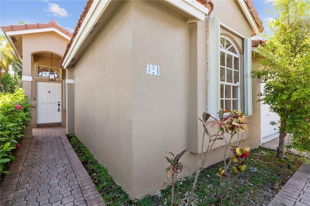 324 NW 107th Ave, Pembroke Pines, FL 33026 - property entrance with stucco siding and a tiled roof