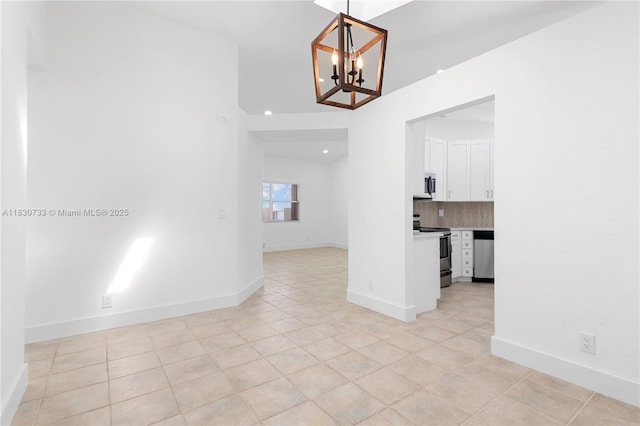 324 NW 107th Ave, Pembroke Pines, FL 33026 - empty room featuring a chandelier, light tile patterned floors, and recessed lighting