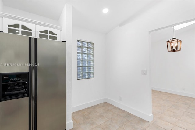 324 NW 107th Ave, Pembroke Pines, FL 33026 - kitchen with stainless steel fridge with ice dispenser, a chandelier, recessed lighting, and light tile patterned floors