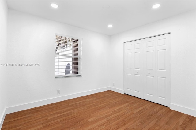 324 NW 107th Ave, Pembroke Pines, FL 33026 - unfurnished bedroom with light wood finished floors, recessed lighting, and a closet