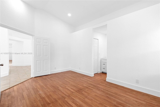 324 NW 107th Ave, Pembroke Pines, FL 33026 - empty room with light wood-style flooring and high vaulted ceiling
