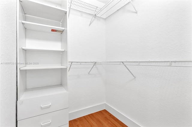 324 NW 107th Ave, Pembroke Pines, FL 33026 - spacious closet featuring wood finished floors