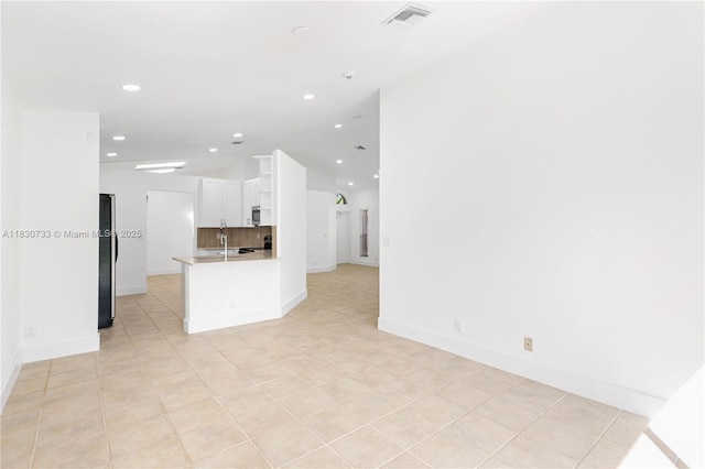324 NW 107th Ave, Pembroke Pines, FL 33026 - unfurnished living room featuring lofted ceiling and recessed lighting