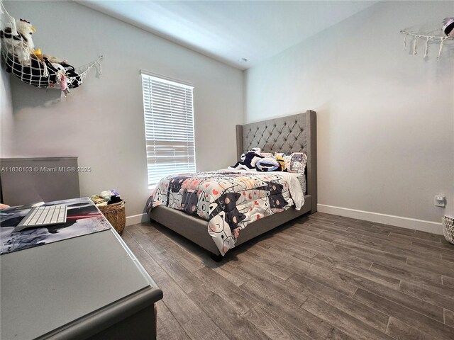 16190 Melogold Dr, Loxahatchee, FL 33470 - bedroom featuring wood finished floors and an office area