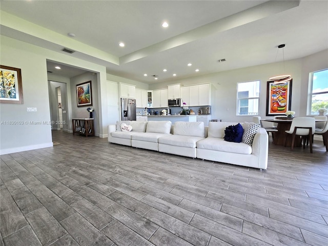 16190 Melogold Dr, Loxahatchee, FL 33470 - living room featuring wood finished floors and recessed lighting