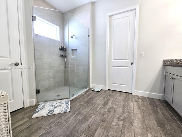 16190 Melogold Dr, Loxahatchee, FL 33470 - full bath with wood finished floors, vanity, and a stall shower