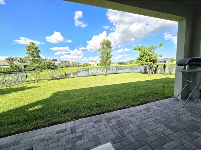 16190 Melogold Dr, Loxahatchee, FL 33470 - fenced backyard featuring a water view, a patio area, and a residential view