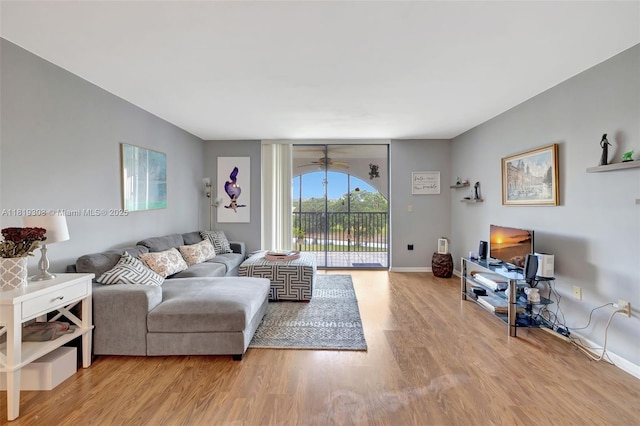 3650 Environ Blvd Unit 502, Lauderhill, FL 33319 - living area with wood finished floors and ceiling fan