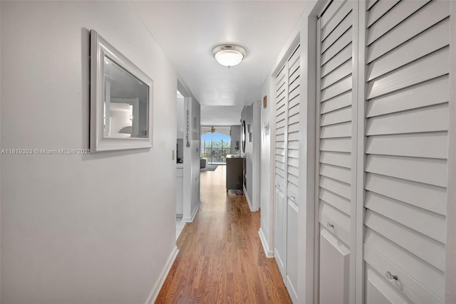 3650 Environ Blvd Unit 502, Lauderhill, FL 33319 - hallway featuring light wood-style floors and baseboards