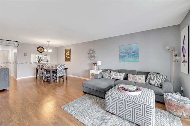 3650 Environ Blvd Unit 502, Lauderhill, FL 33319 - living area featuring wood finished floors and a chandelier