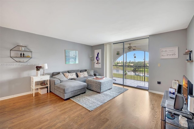 3650 Environ Blvd Unit 502, Lauderhill, FL 33319 - living room featuring wood finished floors and a ceiling fan