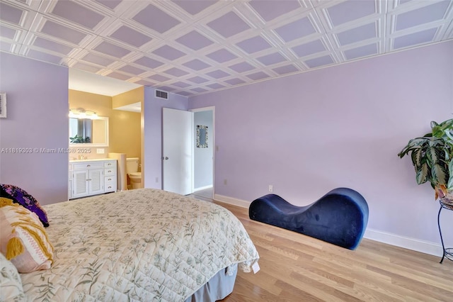 3650 Environ Blvd Unit 502, Lauderhill, FL 33319 - bedroom with wood finished floors, an ornate ceiling, and ensuite bath