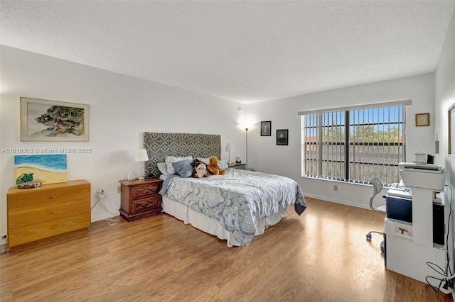 3650 Environ Blvd Unit 502, Lauderhill, FL 33319 - bedroom featuring light wood-style floors and baseboards