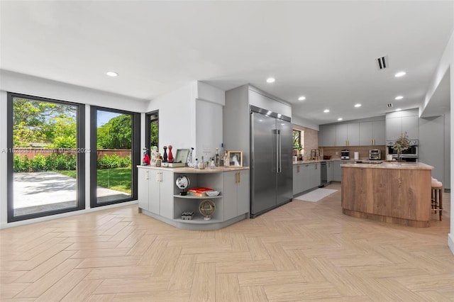 15202 SW 80th Ave, Palmetto Bay, FL 33157 - kitchen featuring appliances with stainless steel finishes, gray cabinets, light countertops, recessed lighting, and modern cabinets