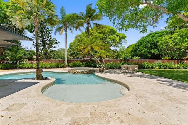 15202 SW 80th Ave, Palmetto Bay, FL 33157 - view of swimming pool with a patio area, a fenced backyard, and a pool with connected hot tub