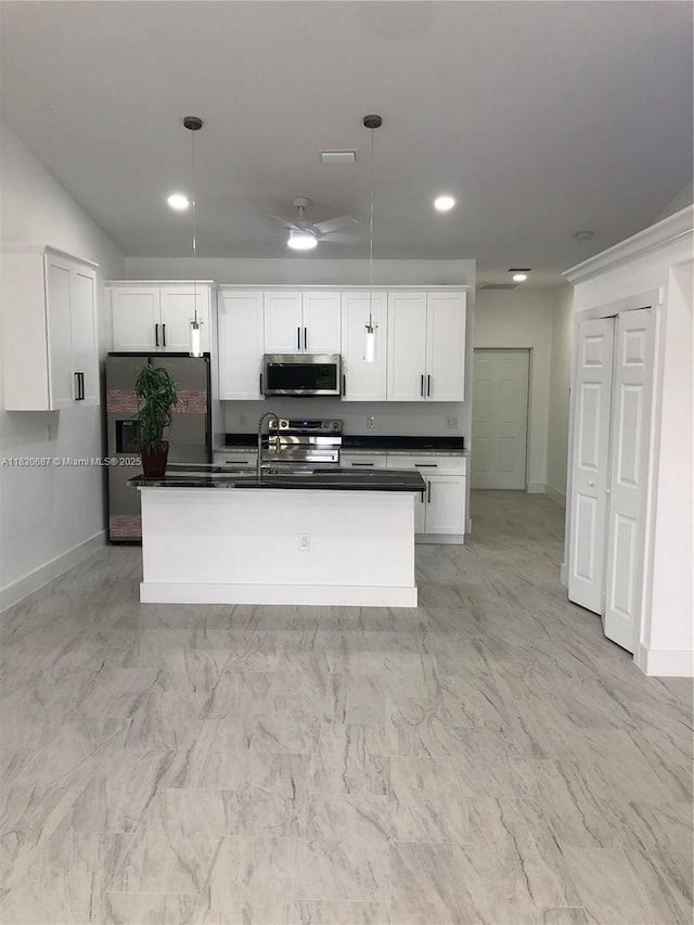 4568/4570 Golfview Blvd, Lehigh Acres, FL 33973 - kitchen featuring stainless steel microwave, dark countertops, fridge with ice dispenser, white cabinets, and stove
