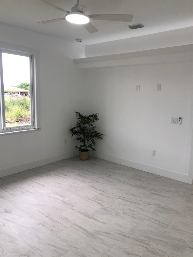 4568/4570 Golfview Blvd, Lehigh Acres, FL 33973 - empty room featuring a ceiling fan and baseboards