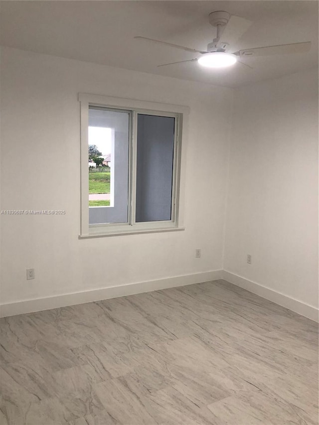 4568/4570 Golfview Blvd, Lehigh Acres, FL 33973 - empty room with a ceiling fan and baseboards