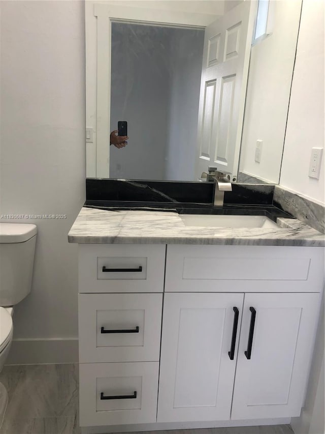 4568/4570 Golfview Blvd, Lehigh Acres, FL 33973 - half bathroom with toilet and vanity