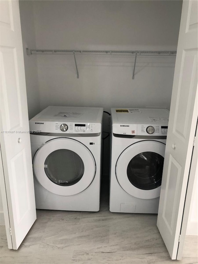 4568/4570 Golfview Blvd, Lehigh Acres, FL 33973 - laundry area with independent washer and dryer and light wood-style flooring
