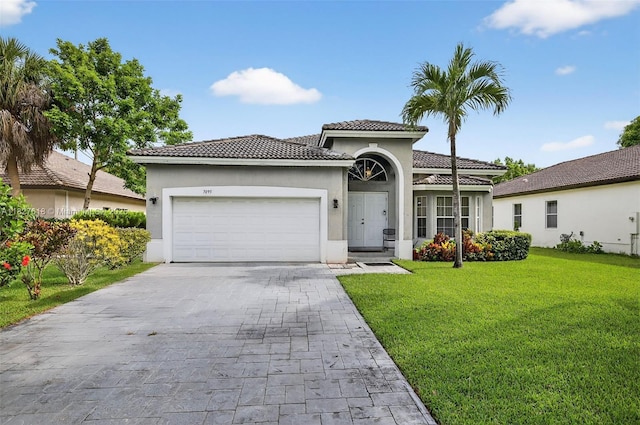 7095 E Tropical Way, Plantation, FL 33317 - mediterranean / spanish house with a tile roof, a garage, decorative driveway, stucco siding, and a front lawn