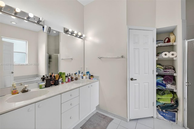 7095 E Tropical Way, Plantation, FL 33317 - full bathroom with double vanity, tile patterned floors, and a shower stall