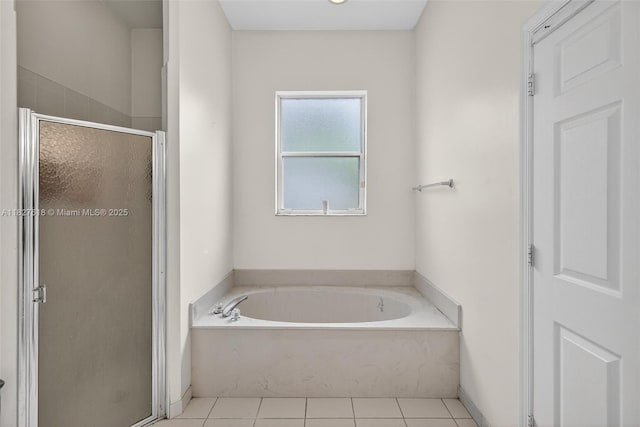 7095 E Tropical Way, Plantation, FL 33317 - bathroom featuring a stall shower, a garden tub, and tile patterned floors