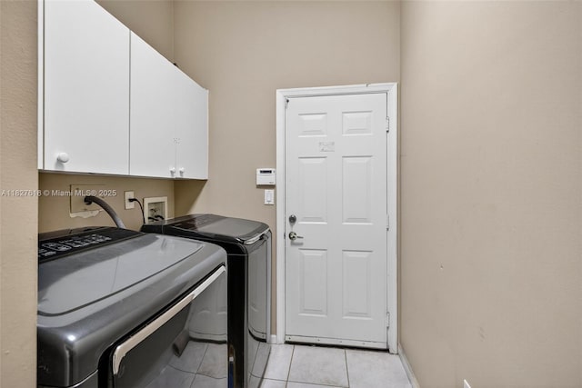 7095 E Tropical Way, Plantation, FL 33317 - laundry area featuring cabinet space, independent washer and dryer, and light tile patterned floors