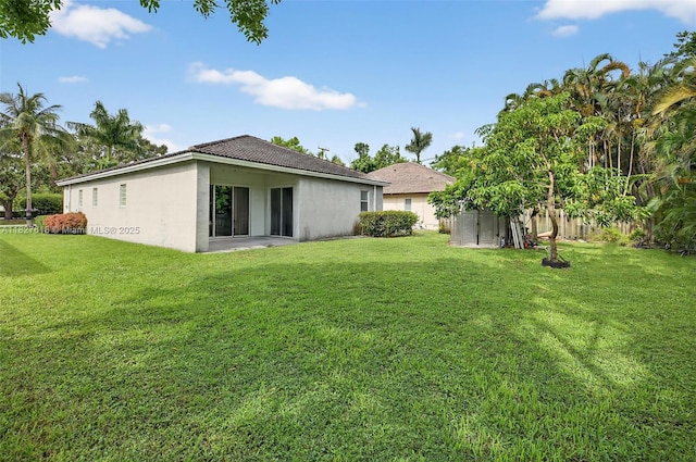 7095 E Tropical Way, Plantation, FL 33317 - back of house with a lawn, stucco siding, and a tiled roof