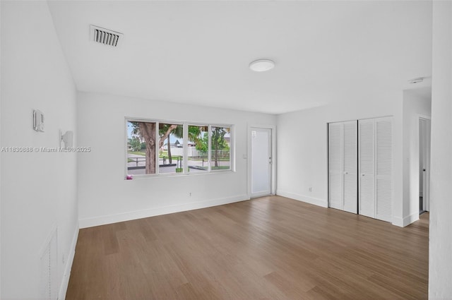 11504 SW 226th St, Miami, FL 33170 - empty room featuring wood finished floors and baseboards
