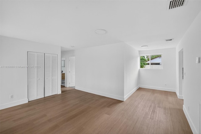 11504 SW 226th St, Miami, FL 33170 - empty room with wood finished floors and baseboards