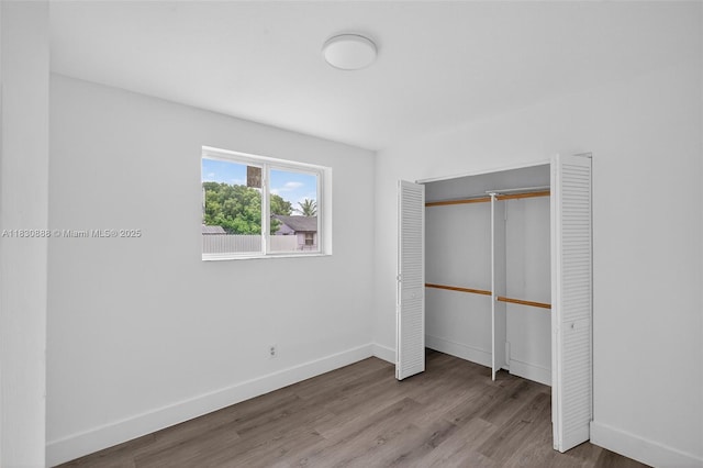 11504 SW 226th St, Miami, FL 33170 - unfurnished bedroom with wood finished floors and a closet