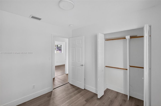 11504 SW 226th St, Miami, FL 33170 - unfurnished bedroom featuring wood finished floors and a closet