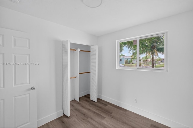 11504 SW 226th St, Miami, FL 33170 - unfurnished bedroom featuring a closet and wood finished floors