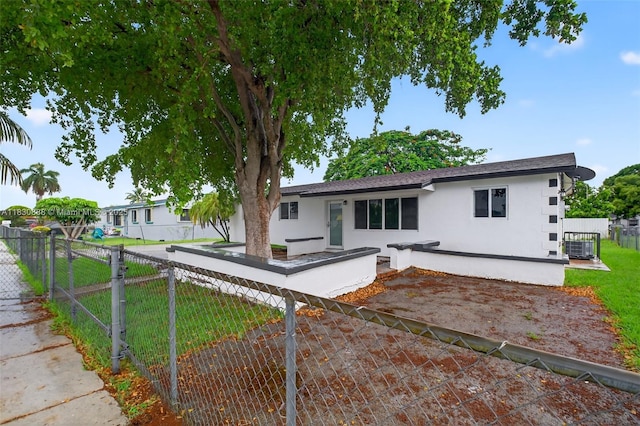 11504 SW 226th St, Miami, FL 33170 - view of front of home with stucco siding and a patio area