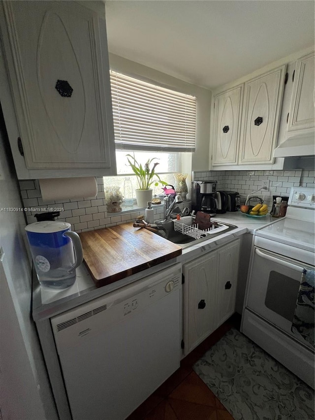 4143 N Ocean Blvd Unit 303, Fort Lauderdale, FL 33308 - kitchen with white appliances, white cabinetry, backsplash, and under cabinet range hood