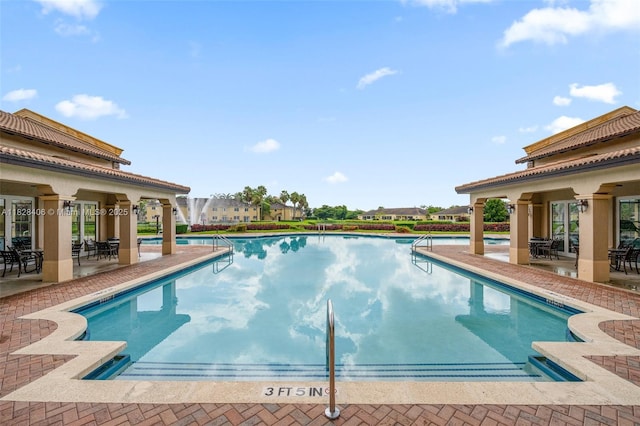 945 NE 34th Ave Unit 103, Homestead, FL 33033 - community pool featuring a patio area and outdoor dining area