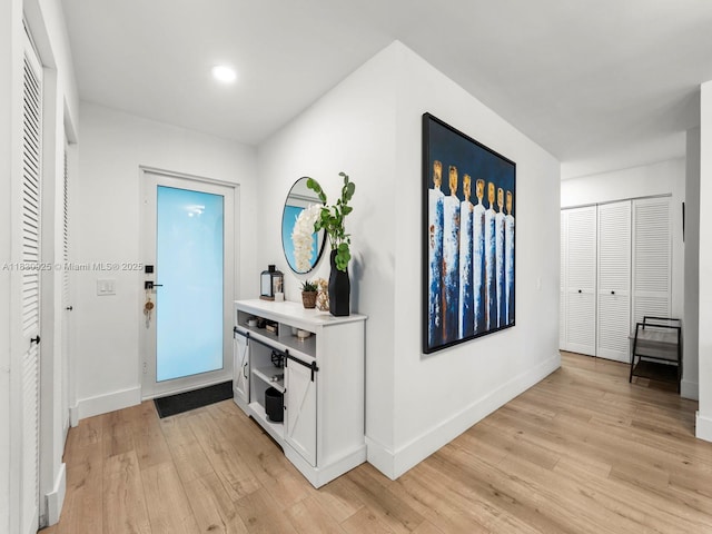 14913 SW 143rd Ct, Miami, FL 33186 - entrance foyer featuring light wood finished floors and recessed lighting