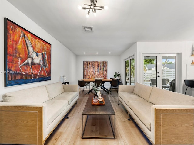 14913 SW 143rd Ct, Miami, FL 33186 - living area with light wood-style floors, a chandelier, and recessed lighting