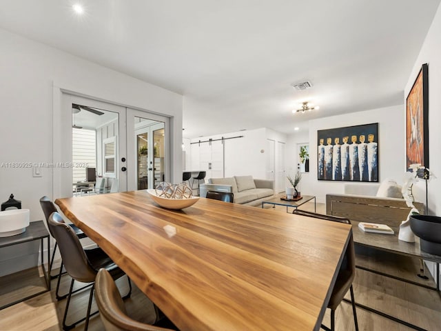 14913 SW 143rd Ct, Miami, FL 33186 - dining space featuring light wood finished floors, french doors, plenty of natural light, and recessed lighting