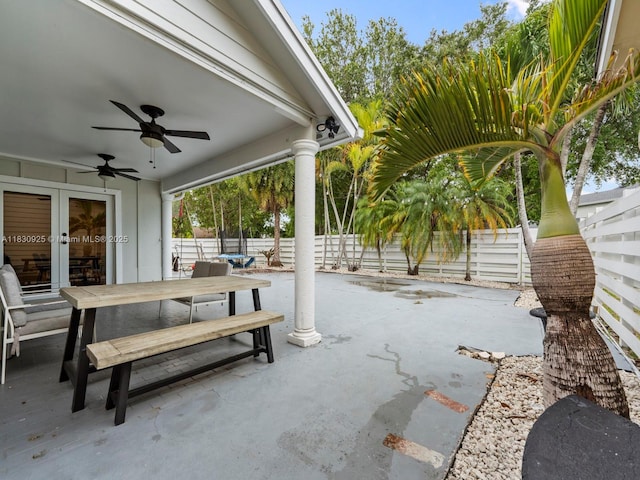 14913 SW 143rd Ct, Miami, FL 33186 - fenced backyard with outdoor dining space, a ceiling fan, a patio area, and french doors