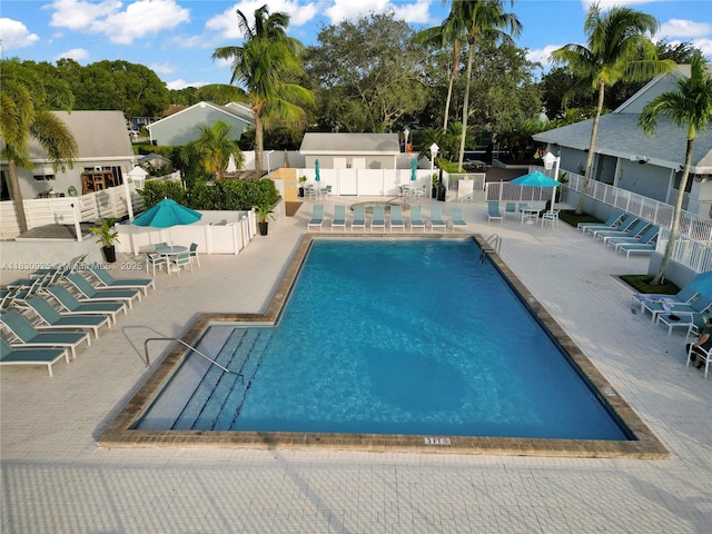 14913 SW 143rd Ct, Miami, FL 33186 - community pool featuring a patio area