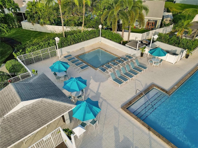 14913 SW 143rd Ct, Miami, FL 33186 - community pool with a patio area and outdoor dining area