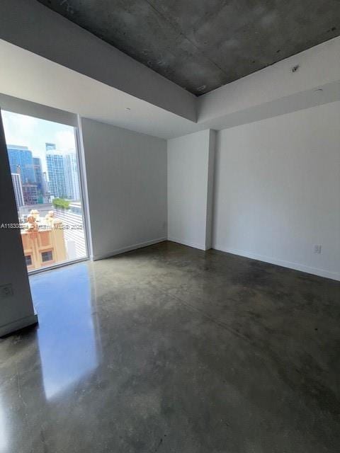 151 SE 1st St Unit 1607, Miami, FL 33131 - empty room with concrete floors and baseboards