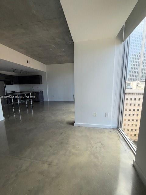 151 SE 1st St Unit 1607, Miami, FL 33131 - unfurnished living room with concrete floors