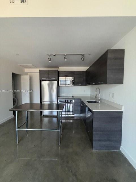 151 SE 1st St Unit 1607, Miami, FL 33131 - kitchen with appliances with stainless steel finishes, modern cabinets, finished concrete floors, and light countertops