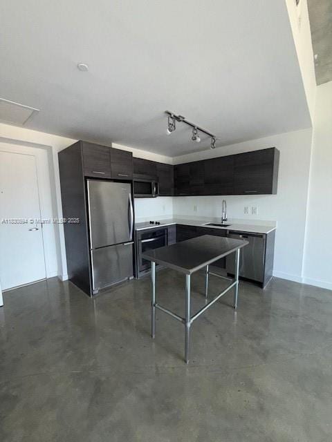 151 SE 1st St Unit 1607, Miami, FL 33131 - kitchen with stainless steel appliances, finished concrete floors, modern cabinets, a kitchen island, and rail lighting