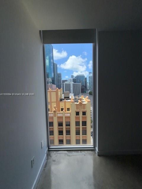 151 SE 1st St Unit 1607, Miami, FL 33131 - unfurnished room featuring concrete floors and baseboards