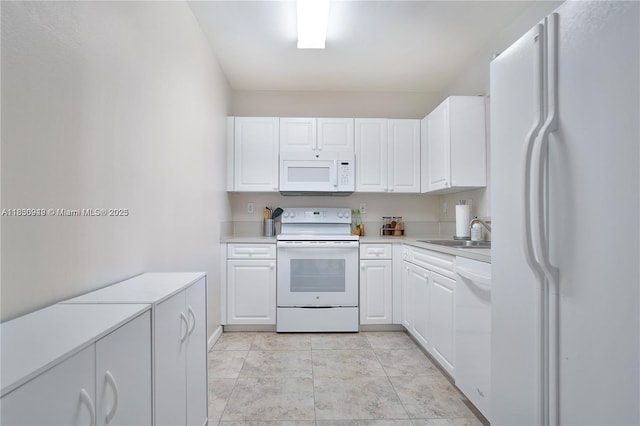 520 SE 5th Ave Unit 1707, Fort Lauderdale, FL 33301 - kitchen with white appliances, white cabinetry, and light countertops