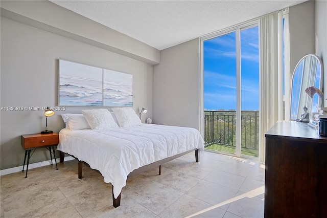 520 SE 5th Ave Unit 1707, Fort Lauderdale, FL 33301 - bedroom featuring expansive windows, a textured ceiling, access to outside, and light tile patterned floors